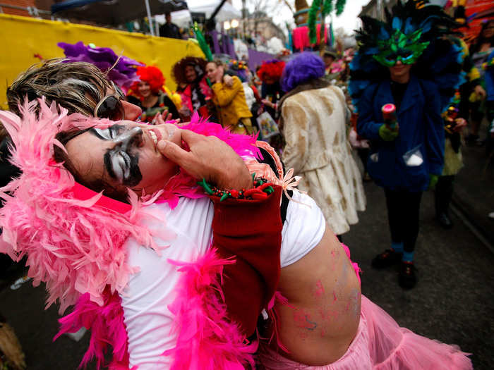 The Krewe of Mondo Kayo Social Marching Club processed in the rain during Mardi Gras.