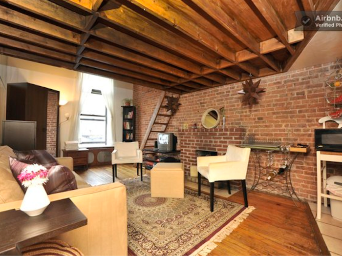 Get cozy in this brick-lined apartment.