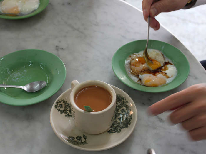 The kaya toast is served with coffee and soft-boiled eggs. You