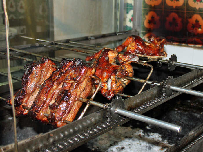 This hawker center vendor serves spit-roasted pork and chicken.