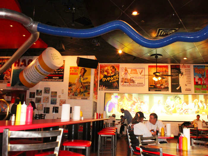 The interior is a kitschy mess, with a huge stethoscope spanning the ceiling and plenty of jokey signs with burger and weight puns.