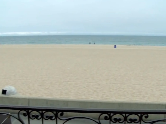 The master suite has a private balcony offering beachfront views.