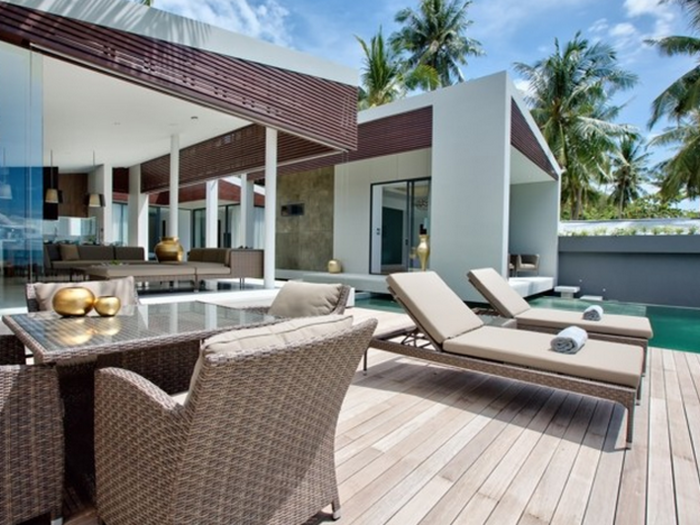 The pool deck lies just beyond the living room.