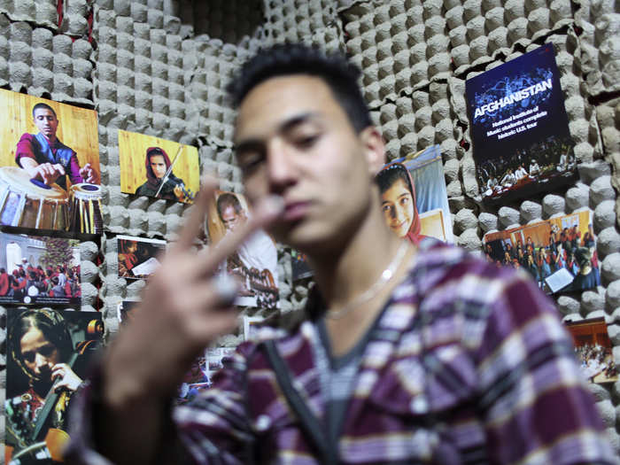 ... To established musicians, like rapper Mahmoud Hejran, recording in a homemade studio.