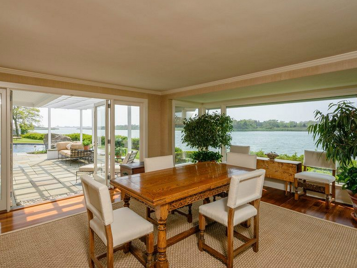 And the dining room opens up to the backyard patio where you can get a glimpse of the in-ground pool.