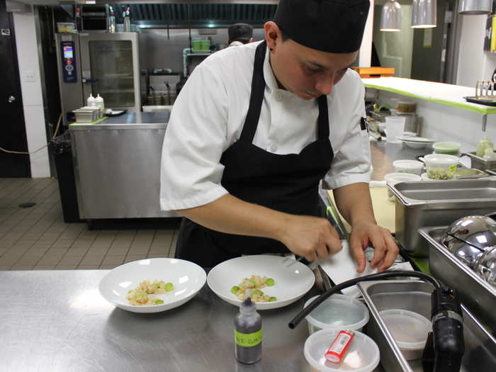 Line chefs worked on plating dishes, like the smoked scallops seen here.