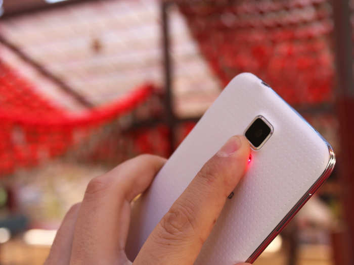 The Galaxy S5 reads your pulse when you place the tip of your finger on a sensor next to the camera flash.