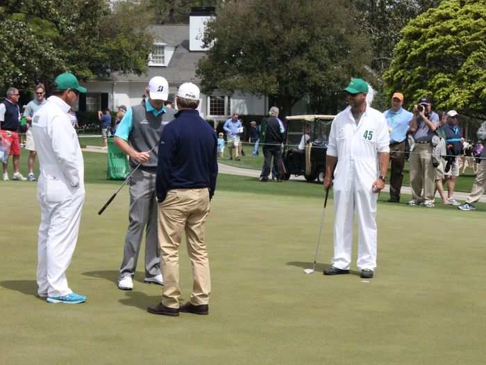 Brandt Snedeker checks out his putter on the practice green that