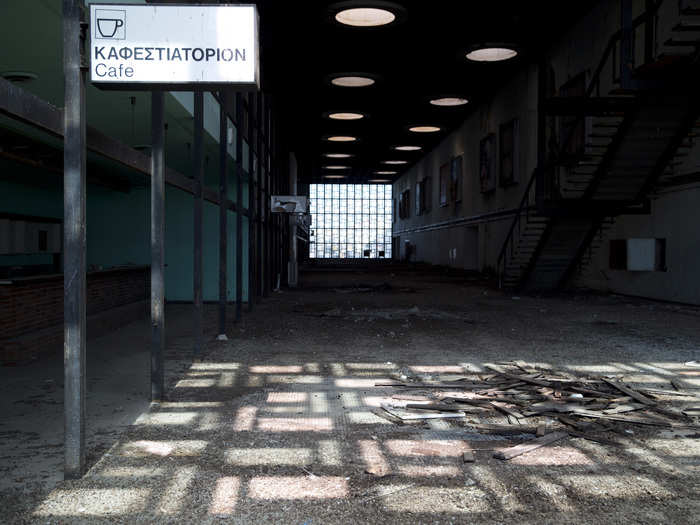 A cafe within the airport stands abandoned.