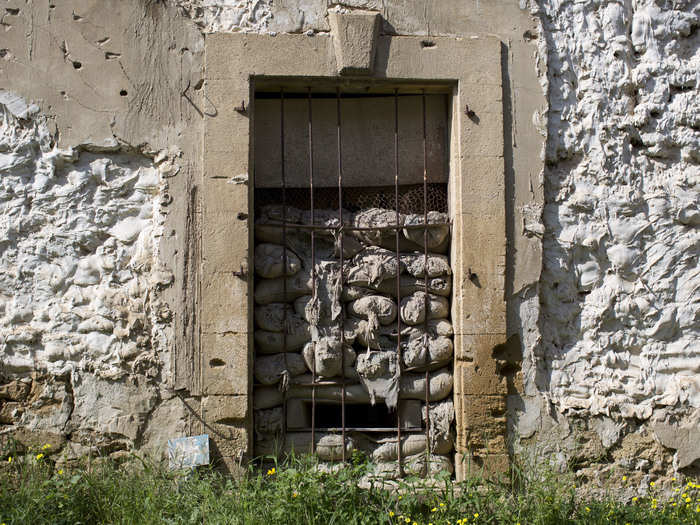 In some cases, the doors of former houses were filled with sand bags and turned into firing positions.