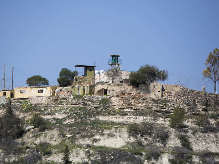 Watch towers dot the landscape, providing surveillance opportunities along the entire length of the divide.