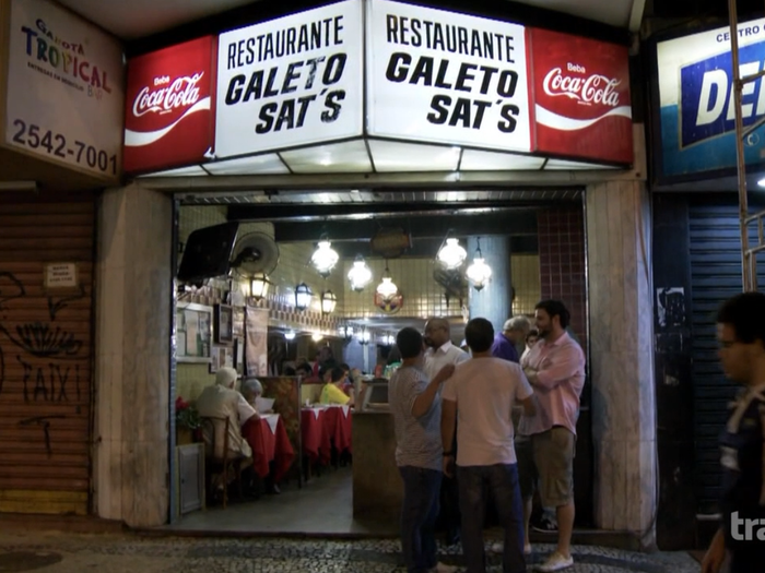 Bourdain meets up with Camillo at Galeto Sat’s, a local favorite for late-night chicken dining.