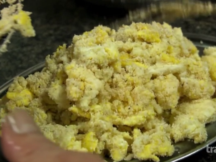 Served with a side of manioca (starch from cassava plant) which is made with farofa (toasted manioc flour) scrambled with eggs.