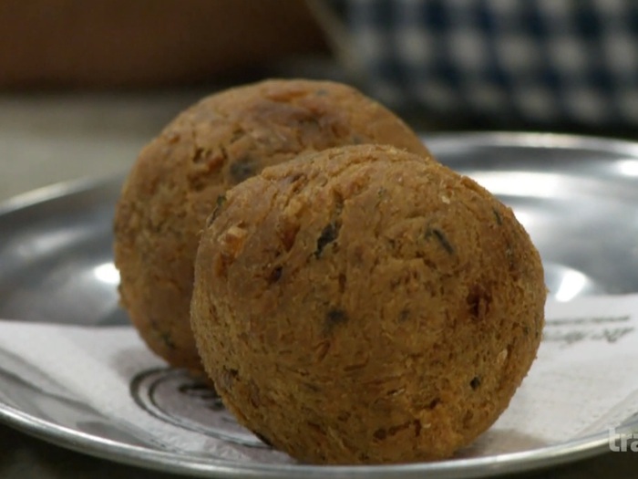 They munch on the Portuguese snack of Bolinhos, which is just deep fried balls with salt cod.