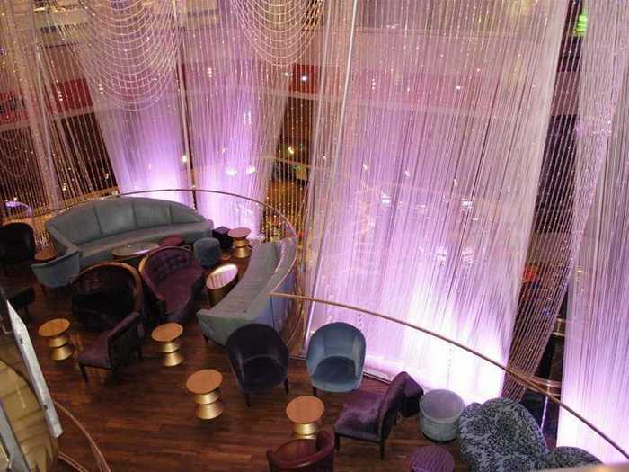 The second floor, which is enshrouded by the massive crystal chandelier, is a cocktail lounge.