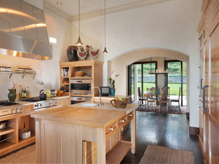 The kitchen has a huge range, and an island for extra cooking space.