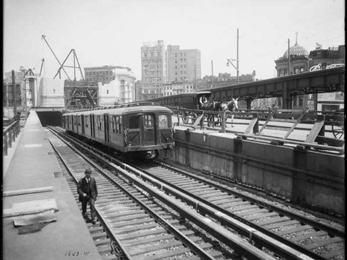 The Manhattan Bridge with subway cars, June 24, 1915.