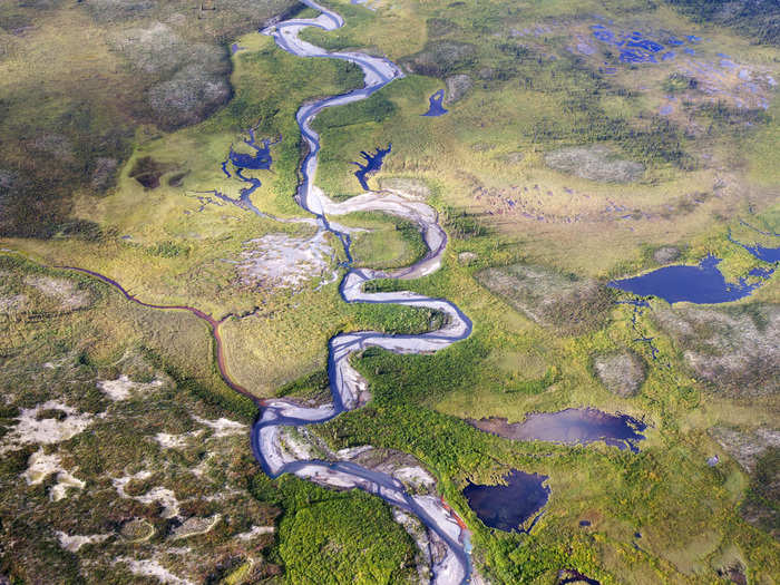 A river runs through a valley near Moose Pond in Canada