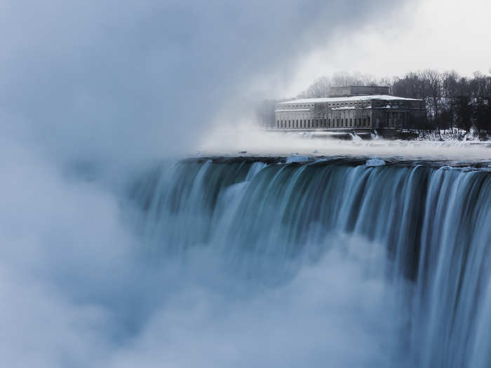 An old hydro building is seen behind Niagara Falls during sub-freezing temperatures in Niagara Falls, Ontario.