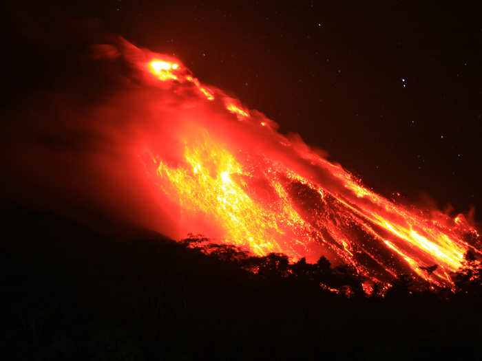 Volcano Mount Karangetang spews lava as seen from Bebali village in Indonesia.