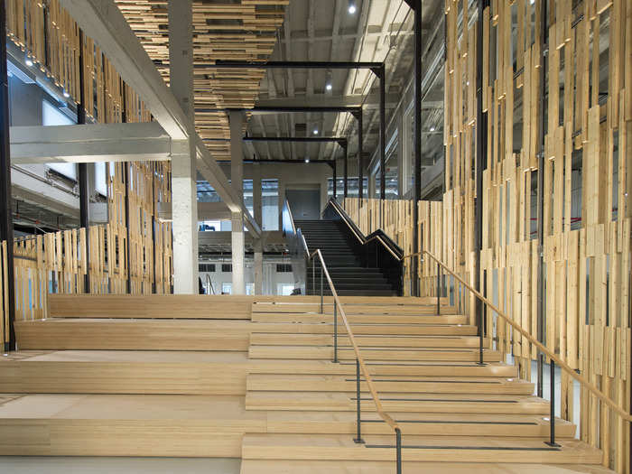 Designed by the architecture firm Gensler, the headquarters include both modern design and natural touches such as wooden stairs.