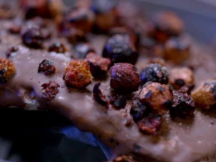 This experimentation and creativity results in incredible, memorable, and delicious dishes, like this dessert of pork skin covered in chocolate with freeze-dried blackberries. It