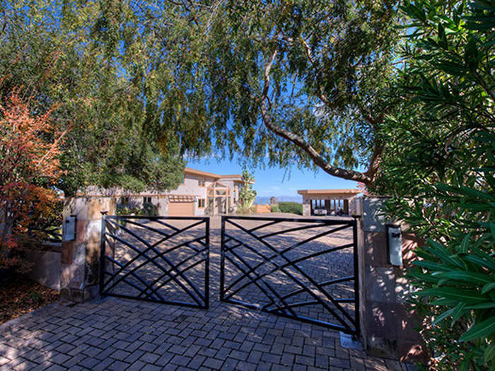 The house is ultra-private, set behind a gate and lots of leafy trees.