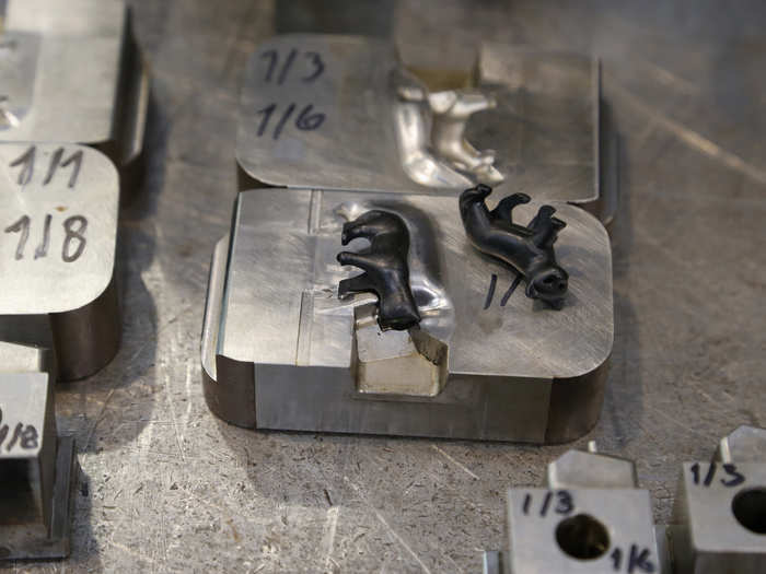 Animal figurines lay in the injection mold.