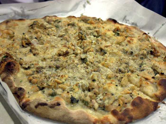 CONNECTICUT: Famed New Haven pizza spot Frank Pepe’s is home of the white clam pie, which contains oregano, grated cheese, chopped garlic, and fresh littleneck clams.
