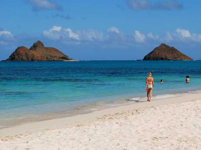 8. Lanikai Beach on the east coast of Oahu, Hawaii, is an optimal place to watch the moon rise over the Mokuluas, the twin islands visible from the beach.