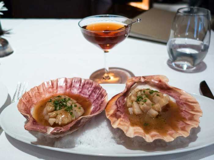 One of the dishes Eric Ripert is known for is his barely cooked scallop served in fragrant brown butter dashi broth. The scallop is translucent on the inside, and lightly cooked on top for a sweet, tender, and meaty dish.