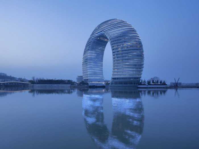 #3 SHERATON HUZHOU HOT SPRING RESORT — A luxury hotel and resort in Huzhou, China, the horseshoe-shaped Sheraton has 19,000 LED lights that illuminate it at night. Its unique shape also allows all the rooms to have balconies and views.