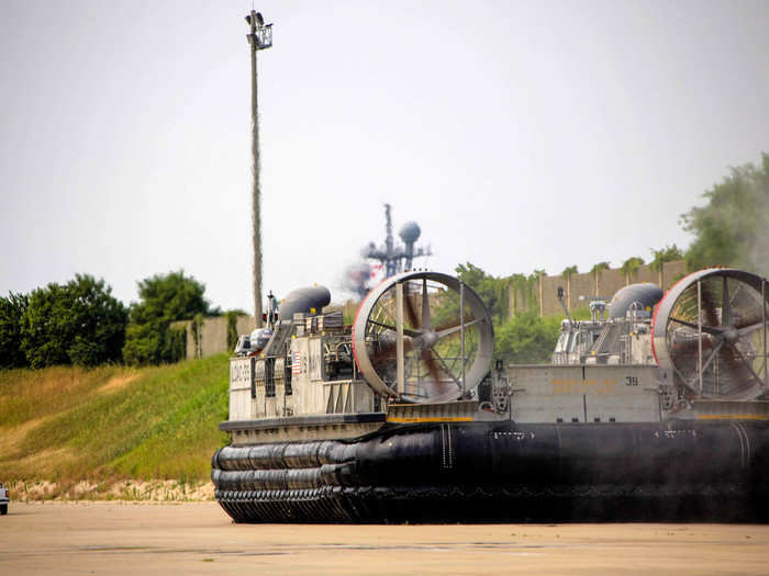 A quick spin around the tarmac to dry off and LCAC 39 prepares to park. That ship in the distance is the USS Ashland on its way to Japan.