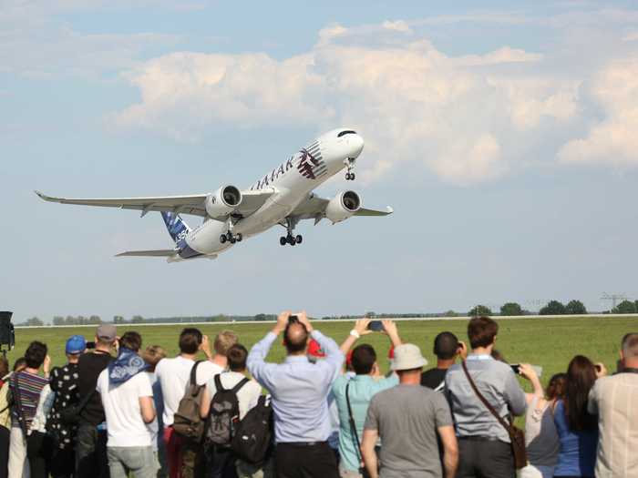 An Airbus 350XWB prototype wearing Qatar Airways livery took off.