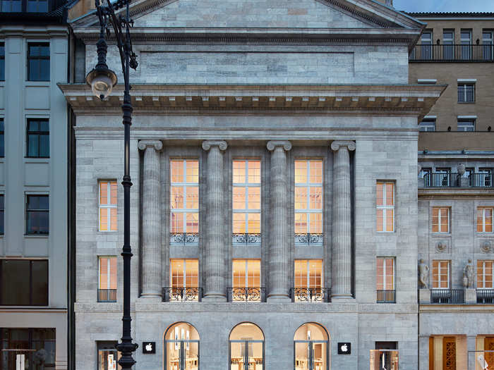 In Berlin, Apple installed a store in an opera house that dates back to 1913. The walls are made of limestone from a local quarry, and thick German oak tables display the latest products.