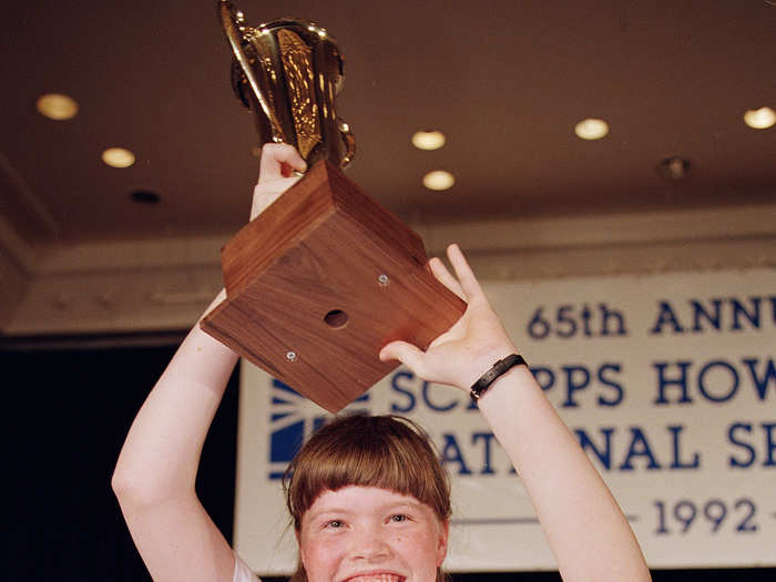 Amanda Goad holds her trophy up triumphantly in 1992, thrilled she spelled "lyceum."