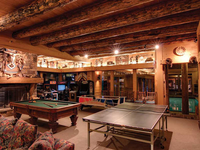 The game room has the "ambiance of Yellowstone National Park Lodge," according to the listing.