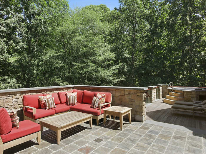 The kitchen has direct access to this outdoor lounging area, complete with jacuzzi.