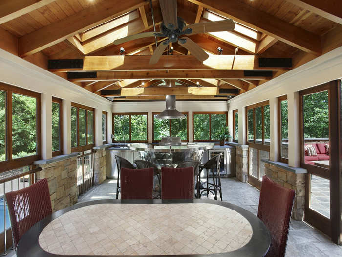 A screened grilling room also opens on to the patio.