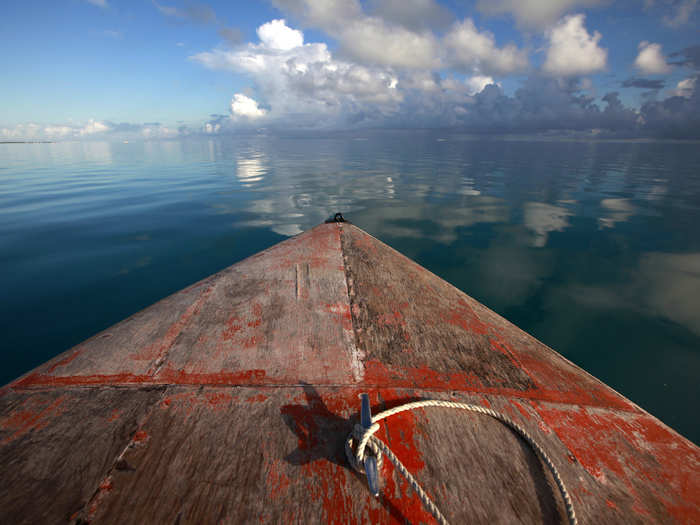 Because Kiribati stands only a few feet above sea level, its islands are extremely vulnerable to rising waters.