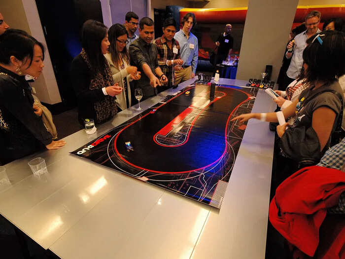 ... But quite a few people were crowded around a demo of Anki Drive.