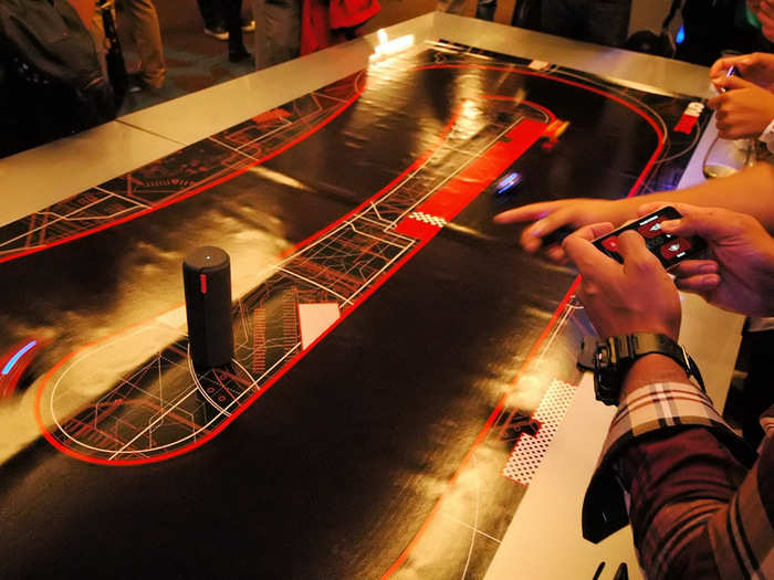 It looks like a typical race track with mini-cars to race, but the interesting difference with Anki Drive is it