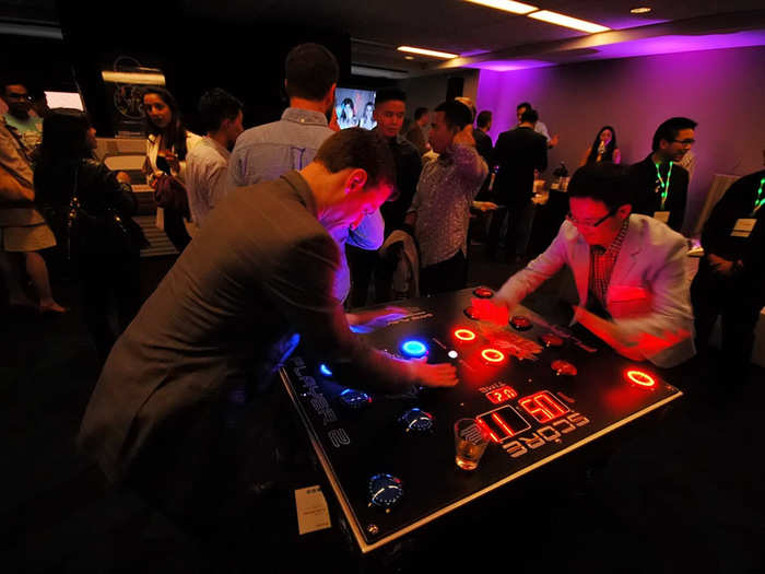 Then there was this game, basically an updated version of "Whack-a-Mole." Ben Feibleman (left), of voice-cloning startup VivoText, was, well, intense.