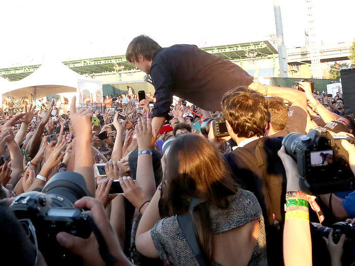 By the time Phoenix started playing, the crowd had packed around the main stage. Singer Thomas Mars jumped into the crowd during their set.