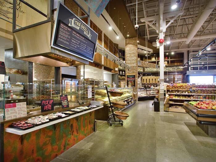 The store has a grill with freshly-prepared foods. More grocers are offering high-quality prepared foods to make their store a destination in the digital age.