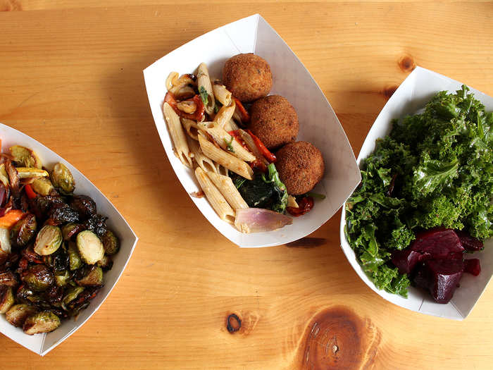 The quick-service menu walks the line between old-school Italian and earthy-crunchy: serving both arancini — rice balls stuffed with fresh risotto, reggiano cheese, and parsley — and raw kale salad with beets.