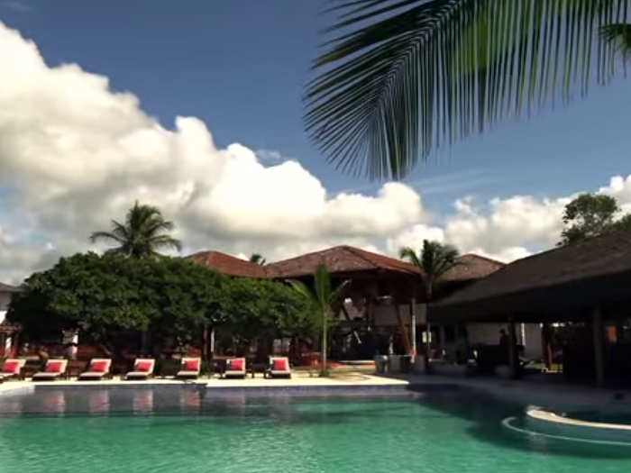 The pool is 2,000-square feet, and has a "World Cup bar" next to it.