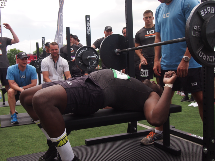 Former Duke football defensive end Phillip Alexander did 42 reps on the bench press for the JPMorgan Chase team.