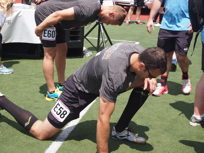 RBC vice president Stephen Raquet stretches before the 800 meter run.