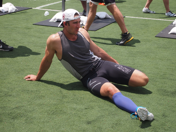 Greyson Clymers of Point72 Asset Management also stretches out before the 800 meter run.